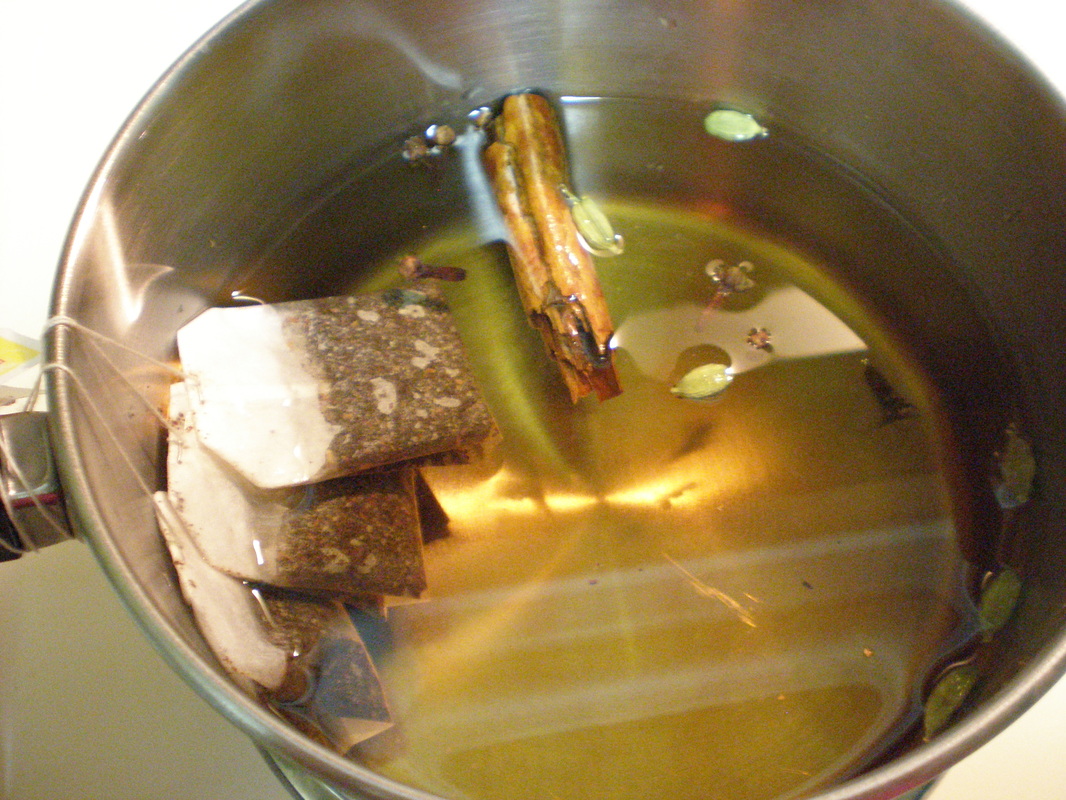 Tea bags and spices in a pot for Homemade Spice Tea